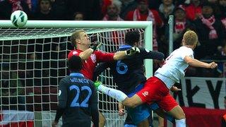 Kamil Glik (right) heads in Poland's equaliser against England