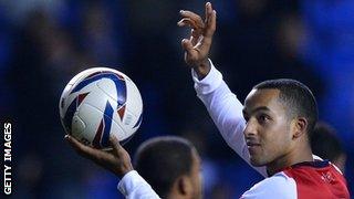 Theo Walcott with the matchball after his hat-trick against Reading