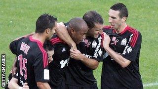 Andrew Ayew (second from left) is congratulated by his team-mates