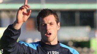 Scotland wing Tim Visser raises his arm in training as he prepares to face New Zealand