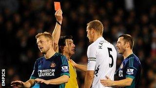 Referee Lee Probert showed Fulham defender Brede Hangeland a straight red card for his challenge on Lee Cattermole