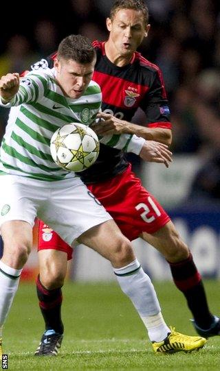 Gary Hooper (left) holds off Benfica's Nermanja Matic