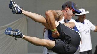 Kevin Pietersen gets to grips with England physio Mark Saxby