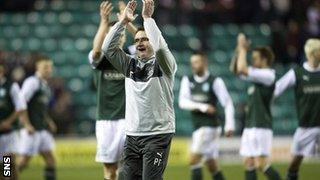 Hibs manager Pat Fenlon salutes the happy home support at Easter Road