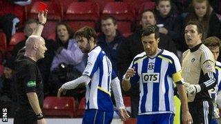 Craig Charleston shows a red card to Jamie Langfield