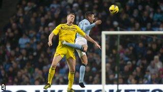 Manchester City's Javi Garcia (right) and Reading's Pavel Pogrebnyak