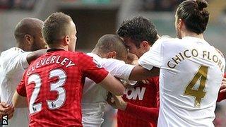 Man Utd striker Robin van Persie (second right) and Swansea defender Ashley Williams are involved in a clash