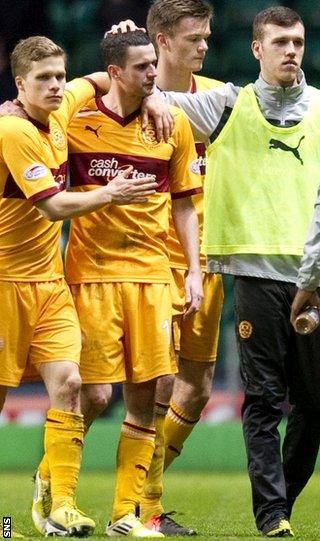 Henrik Ojamaa consoles Jamie Murphy at the final whistle at Celtic Park