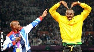 Mo Farah poses alongside Usain Bolt