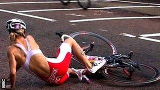 Maria Czesnik of Poland crashes her bike