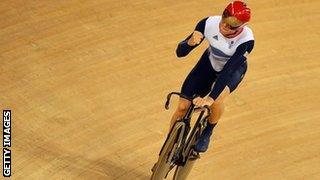 Chris Hoy celebrates as Great Britain win gold in team sprint