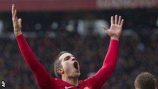 Robin van Persie celebrates after putting Manchester United ahead against Liverpool