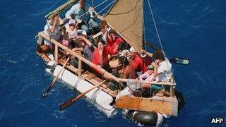 Cubans aboard a homemade raft being picked up by US Coast Guard in 1994