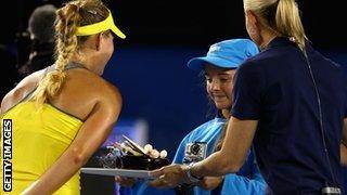 Angelique Kerber is presented with a birthday cake