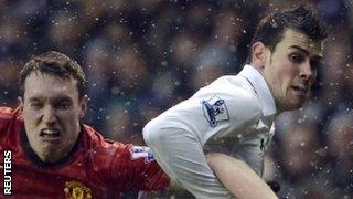 Phil Jones kept a close eye on Tottenham's Gareth Bale