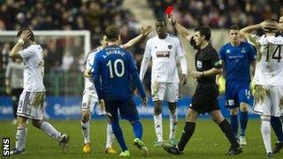 Referee Euan Norris sends off Hearts' Scott Robinson