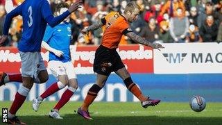 Johnny Russell scores for Dundee United against Rangers