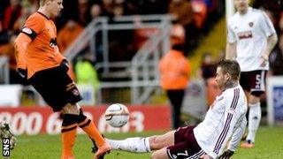 Hearts midfielder Ryan Stevenson tackles Gary Mackay-Steven and is subsequently sent off