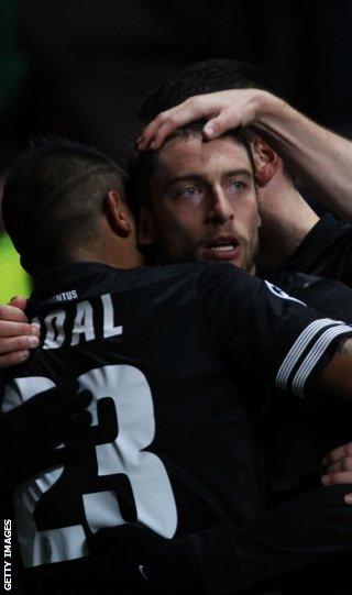 Claudio Marchisio is congratulated by his Juventus team-mates