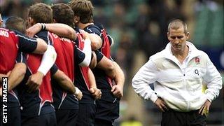 Stuart Lancaster listens on as the players speak pre-match