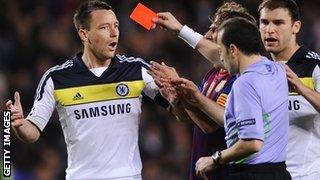 Referer Cuneyt Cakir sends off Chelsea's John Terry against Barcelona in 2012