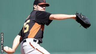 Relief pitcher Barry Zito of the San Francisco Giants pitches against the Los Angeles Angels