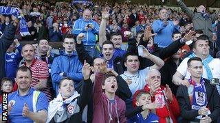 Cardiff City supporters celebrate winning the Championship title