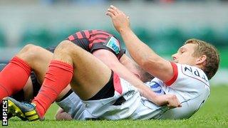 Jonny Wilkinson pats a despondent Owen Farrell on the back after the Saracens fly-half failed to charge down his opposite number's drop-kick