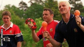 (From left) Ronan O'Gara, Rob Henderson and Will Greenwood play musical instruments before the 2001 Lions tour