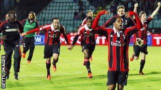 Milan's relieved players celebrate at full-time