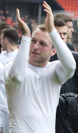 Johnny Russell applauds Dundee United's fans at the end of the season