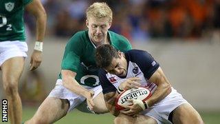 Stuart Olding tackles USA's Mike Petri