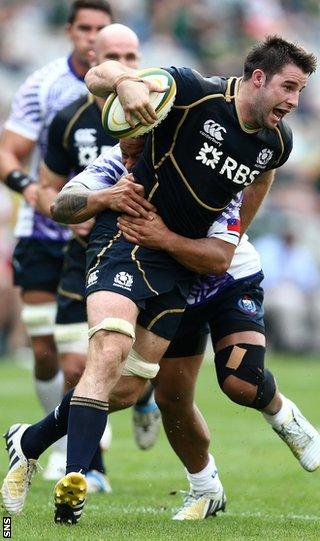 Johnnie Beattie is held up against Samoa