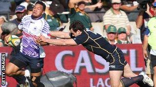 James Sooialo of Samoa dodges a Scottish tackle