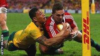 Israel Folau tackles George North to deny the Welshman a try on Saturday