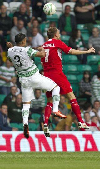 Cliftonville midfielder Ciaran Caldwell rises highest to beat Emilio Izaguiree to the ball