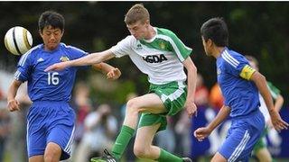 Action from Japanese FA v Co Fermanagh