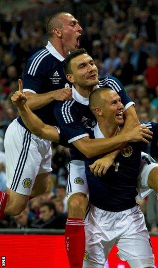 Scott Brown, Robert Snodgras and Kenny Miller celebrate