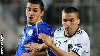 Sergei Khizhnichenko (left) in action against Germany