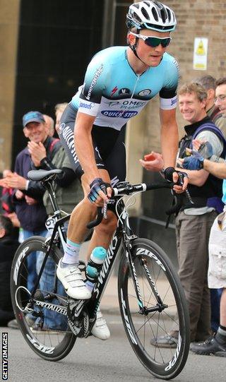 Andy Fenn is applauded by cycling fans in Glasgow at the National Road Race Championships in June