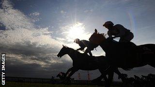 Educate (centre) wins the Cambridgeshire at Newmarket