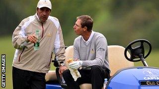 Nicolas Colsaerts of the European team talks with captain Jose Maria Olazabal