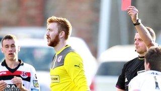 Cliftonville goalkeeper Conor Devlin is sent-off by referee Robert Crangle