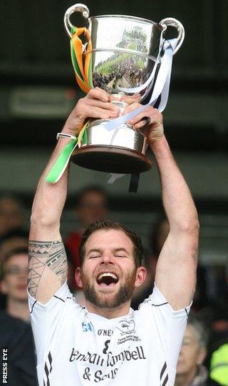 Clonoe captain Stephen McNulty lifts the Tyrone football trophy