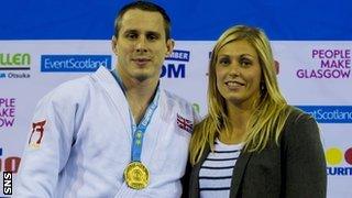 Burton's medal was presented to him by his wife, Olympic silver medallist Gemma Gibbons