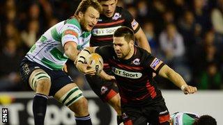 Edinburgh flanker Cornell Du Preez is thwarted by the Marco Fuser