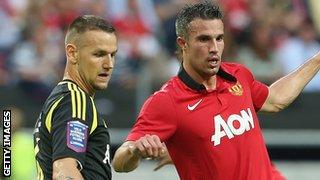 Alexander Milosevic (left) in action for AIK against Manchester United