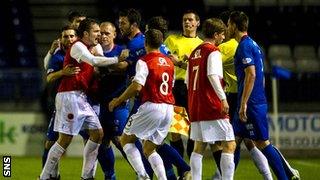 The Inverness and United players become embroiled in a brawl