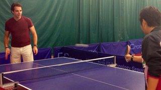 Mark Beaumont plays table tennis with Jing Jun Hong