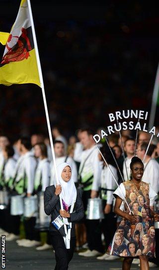 Maziah Mahusin carries the Brunei flag at the opening ceremony of the London Olympics